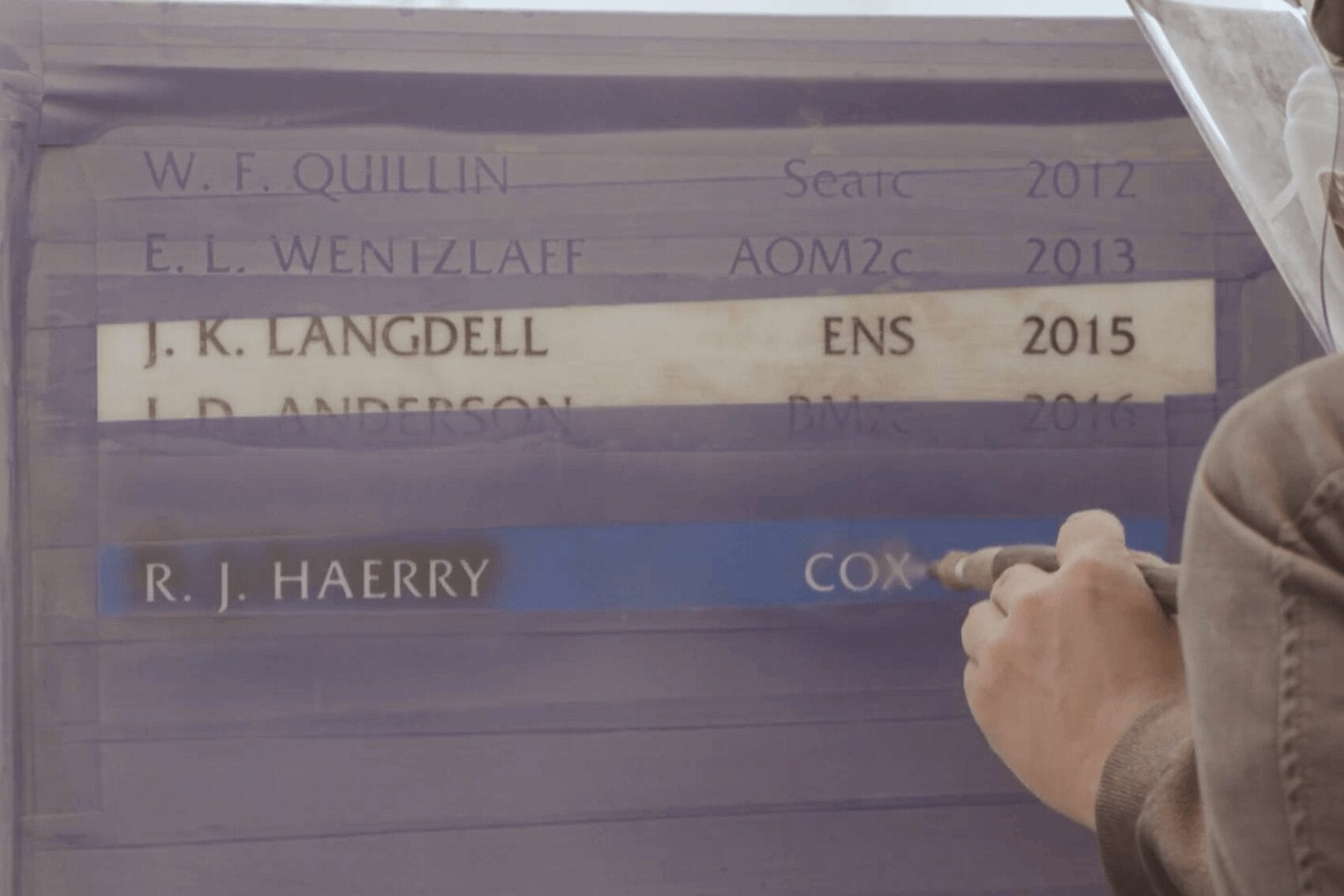 Performing Final Inscription on headstone memorial